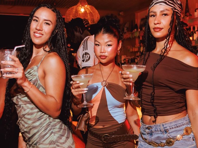 Guests with cocktails at Afro Phuket